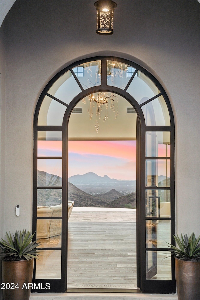 entryway with a mountain view and plenty of natural light