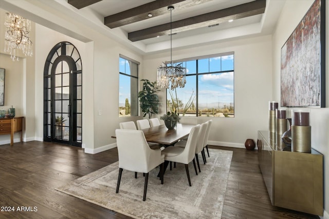 dining area featuring dark hardwood / wood-style flooring, a chandelier, beam ceiling, and a high ceiling