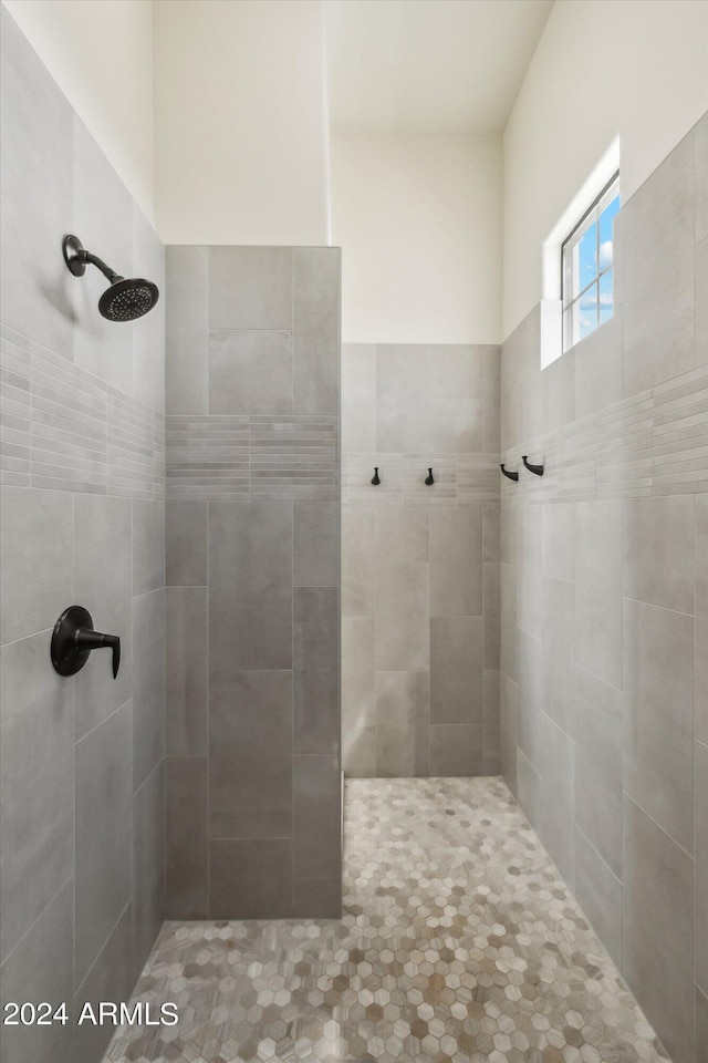 bathroom with a tile shower