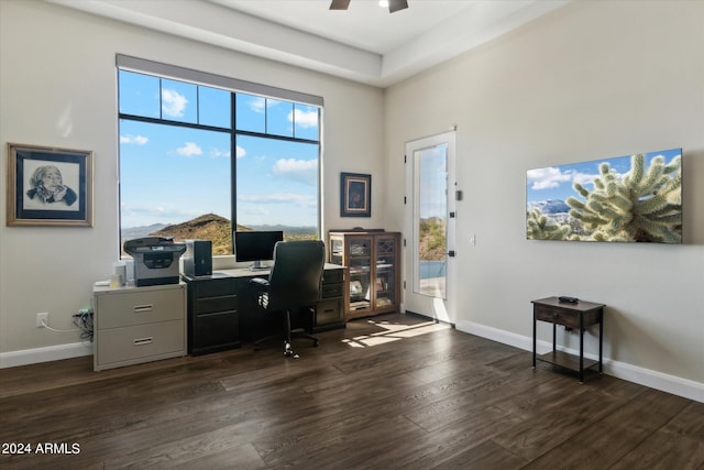 office with dark wood-type flooring and ceiling fan