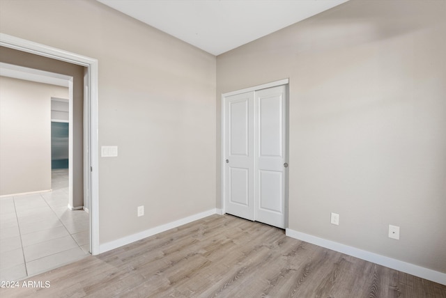 unfurnished bedroom with light hardwood / wood-style flooring