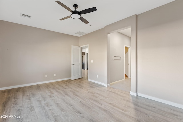 spare room featuring ceiling fan and light wood-type flooring