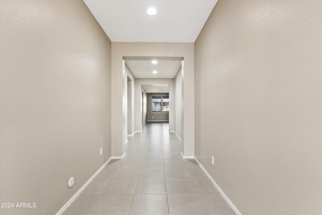 corridor with light tile patterned floors