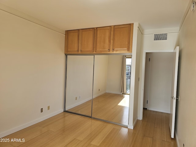 unfurnished bedroom featuring light hardwood / wood-style floors