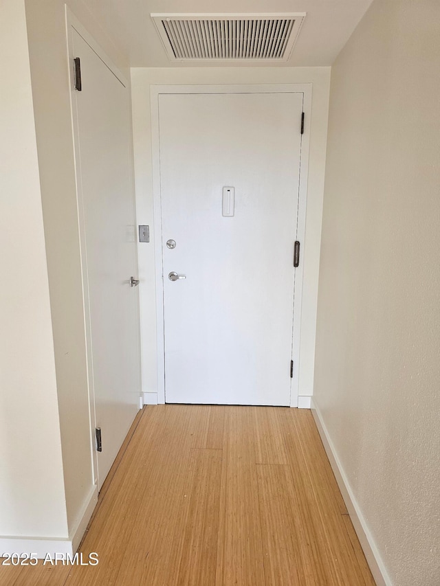 doorway featuring hardwood / wood-style flooring