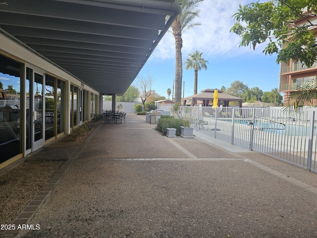 view of patio / terrace with a gazebo and a community pool