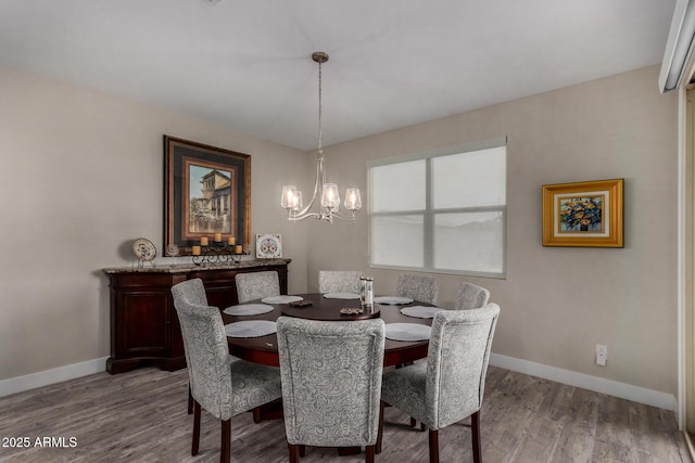 8741 N 185th Ave, Waddell, AZ 85355 - dining area featuring a chandelier and wood finished floors
