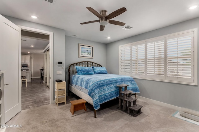 8741 N 185th Ave, Waddell, AZ 85355 - bedroom with light colored carpet, recessed lighting, and ceiling fan