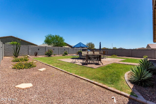 8741 N 185th Ave, Waddell, AZ 85355 - fenced backyard featuring a patio area
