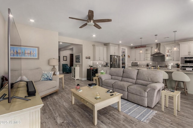 8741 N 185th Ave, Waddell, AZ 85355 - living room featuring ceiling fan, light wood-style floors, and recessed lighting