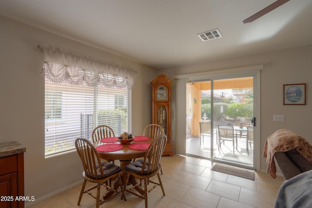 dining area with light tile patterned flooring