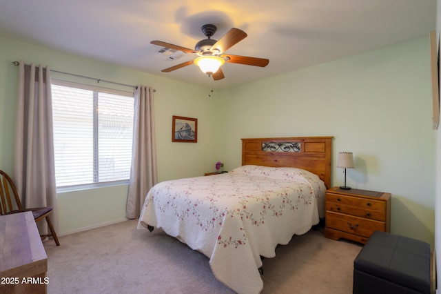 bedroom with light carpet and ceiling fan