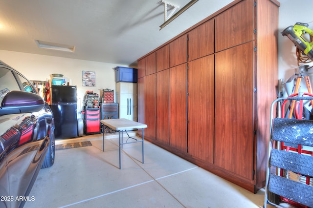 garage with black fridge