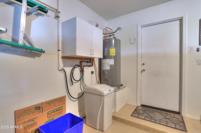 laundry room with cabinets and electric water heater