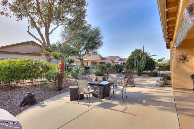 view of patio with an outdoor fire pit