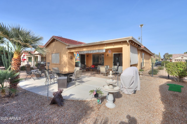 rear view of property with a patio area