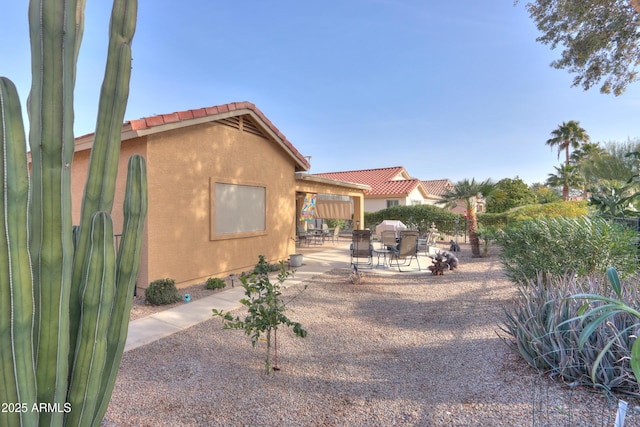 back of house with a patio area