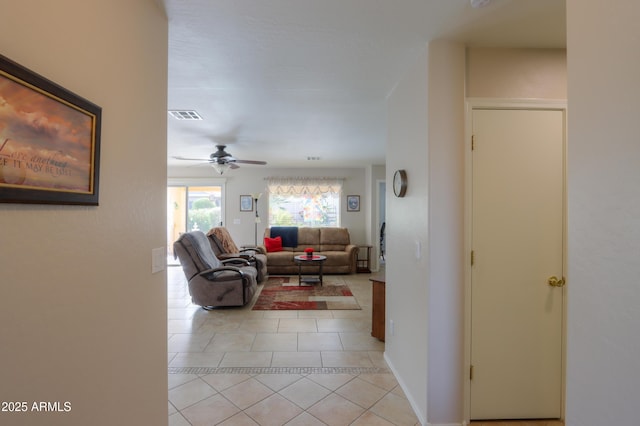 living room with light tile patterned flooring and ceiling fan