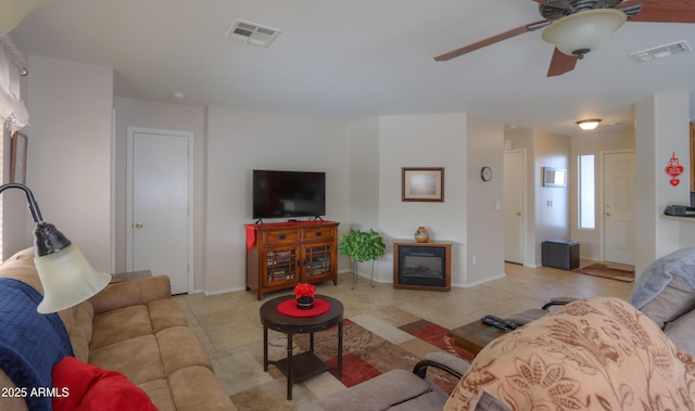 tiled living room with ceiling fan