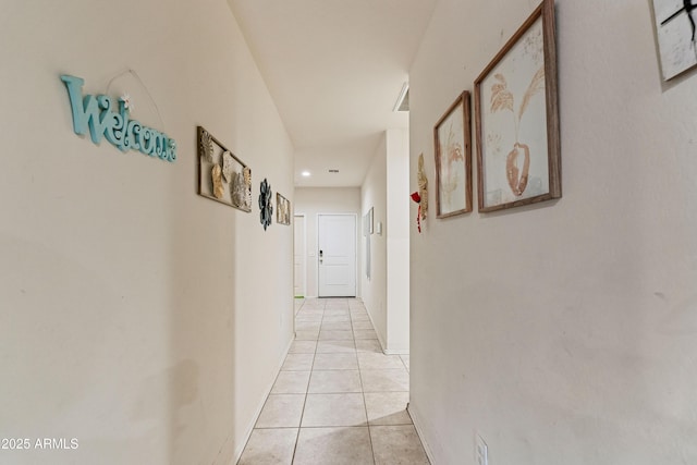 18711 W Farmer Rd, Buckeye, AZ 85326 - hallway with light tile patterned flooring and baseboards