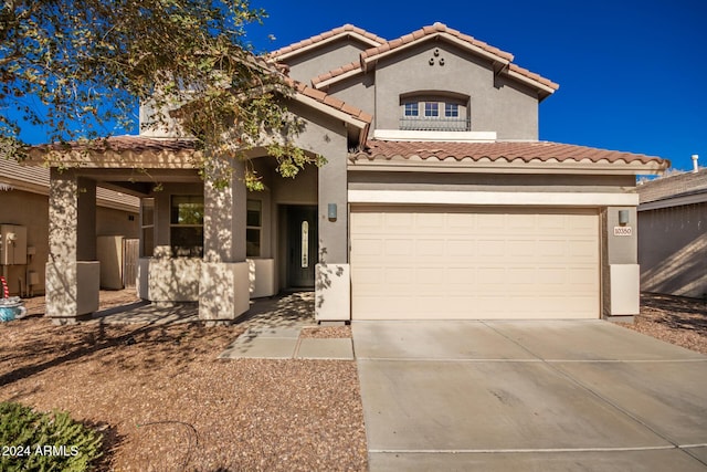 mediterranean / spanish-style home featuring a garage