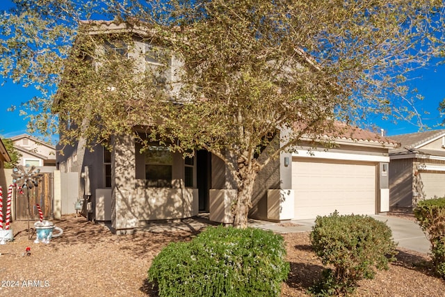 view of front of property with a garage