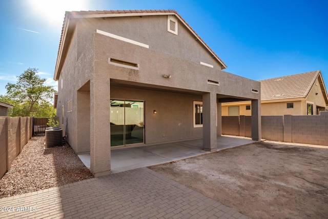 back of property featuring a patio and central AC unit