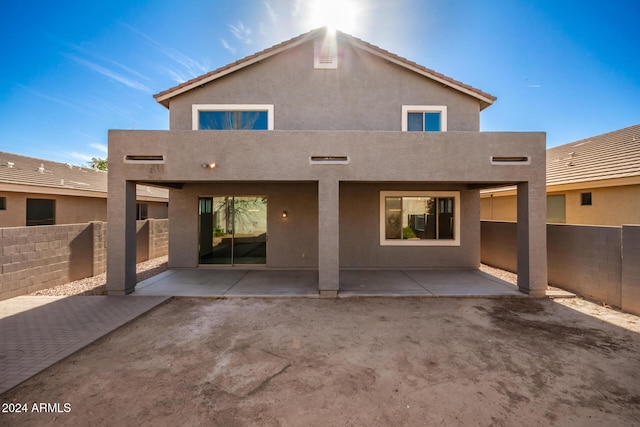 back of house with a patio and a balcony