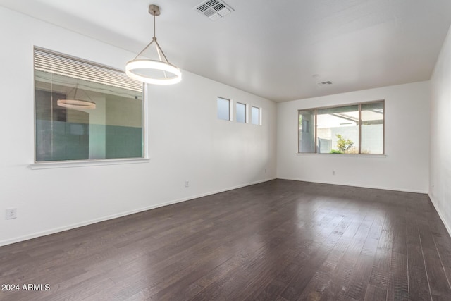 spare room featuring dark hardwood / wood-style floors