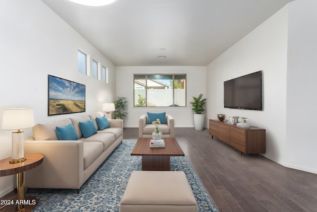 living room with dark hardwood / wood-style flooring