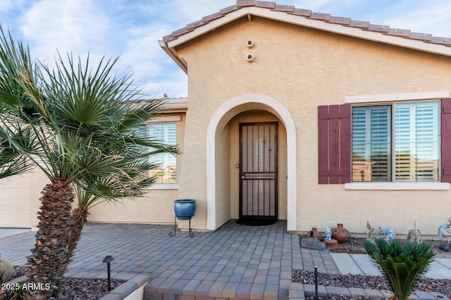 property entrance with a patio