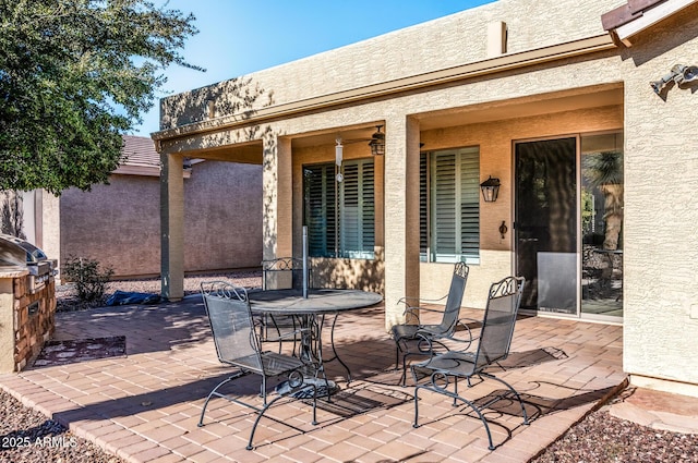 view of patio with a grill