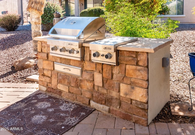 view of patio / terrace with area for grilling and exterior kitchen