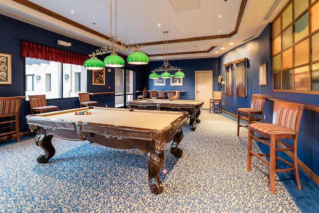 recreation room featuring a tray ceiling, carpet flooring, ornamental molding, and billiards