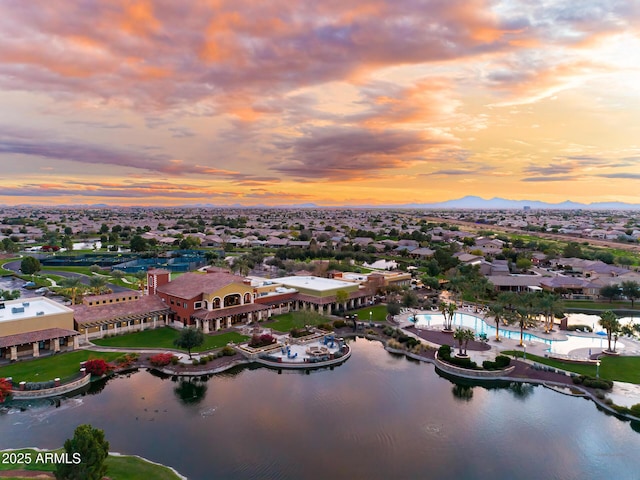 aerial view at dusk with a water view