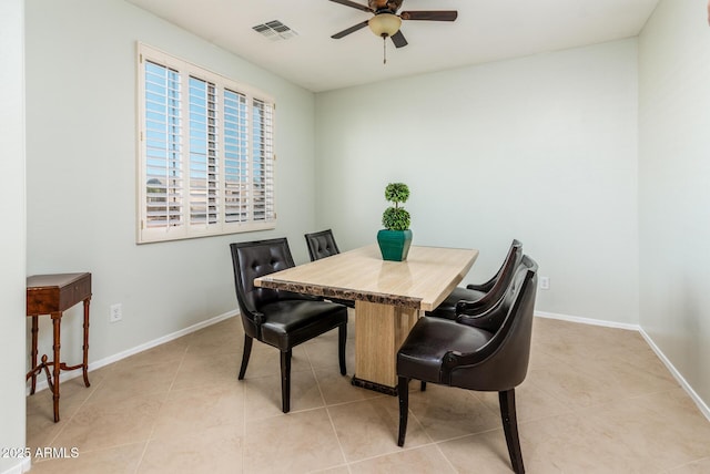 tiled dining room featuring ceiling fan