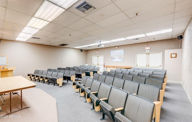 misc room featuring a paneled ceiling, visible vents, and carpet flooring