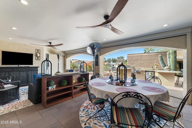 view of patio featuring a ceiling fan and outdoor wet bar