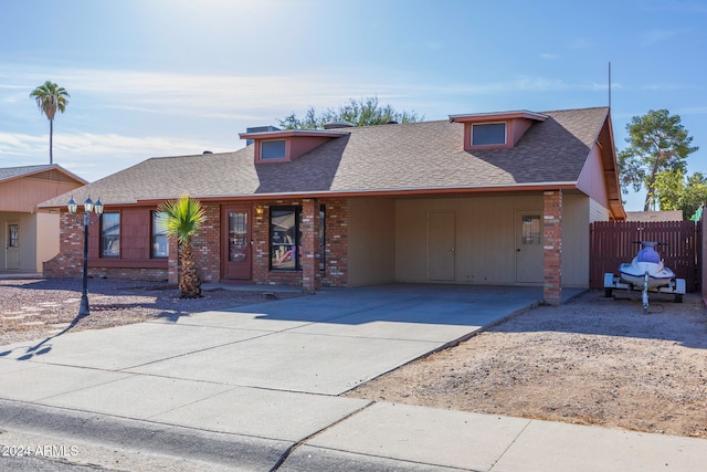 view of front facade with a carport