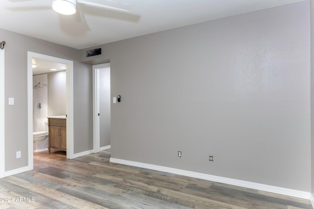 empty room with hardwood / wood-style flooring and ceiling fan