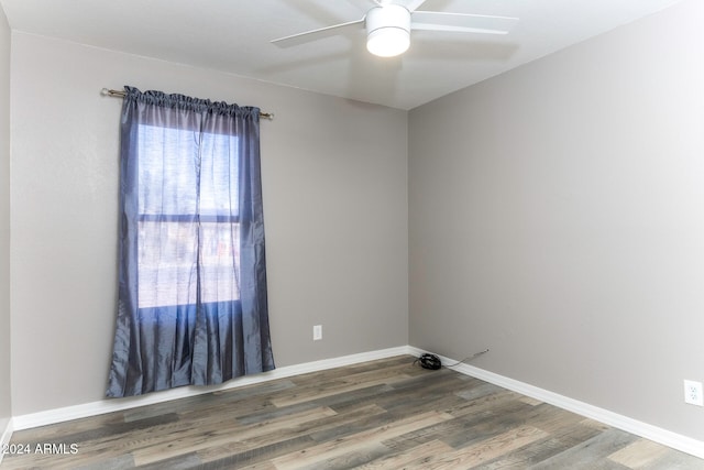 spare room featuring ceiling fan and hardwood / wood-style floors