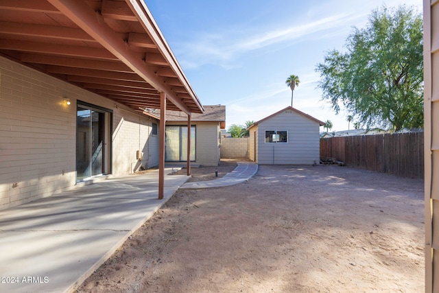 view of patio with a shed