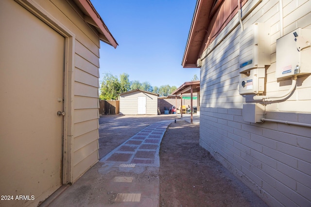 view of patio featuring a shed