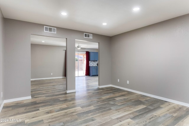 spare room featuring dark wood-type flooring