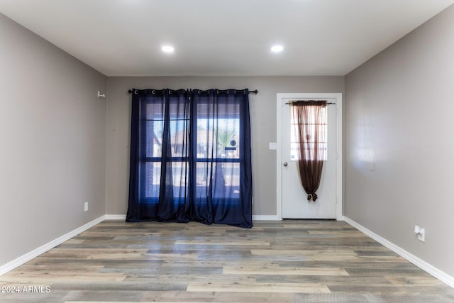 unfurnished room featuring wood-type flooring