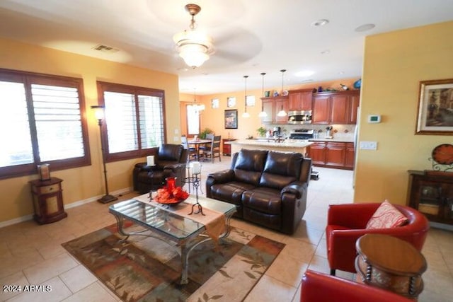 living room featuring ceiling fan and light tile floors