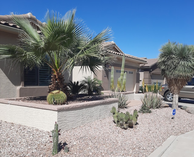 view of property exterior with a garage