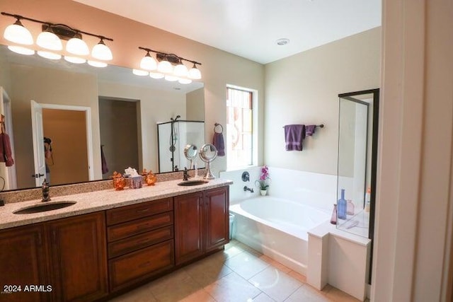 bathroom with independent shower and bath, dual bowl vanity, and tile floors