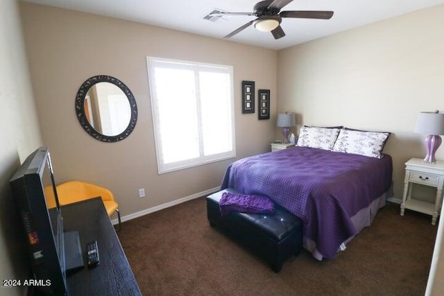 bedroom featuring dark colored carpet and ceiling fan