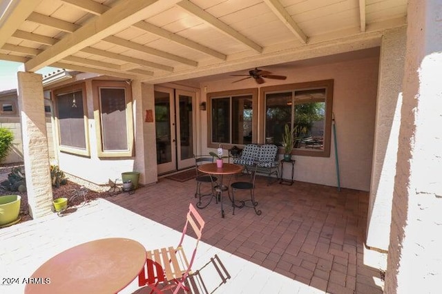 view of patio featuring ceiling fan